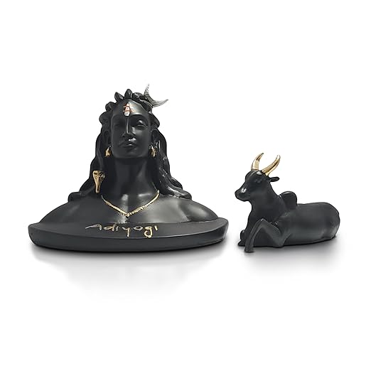 Adiyogi Statue with Nandi in black and gold placed on kitchen countertop.