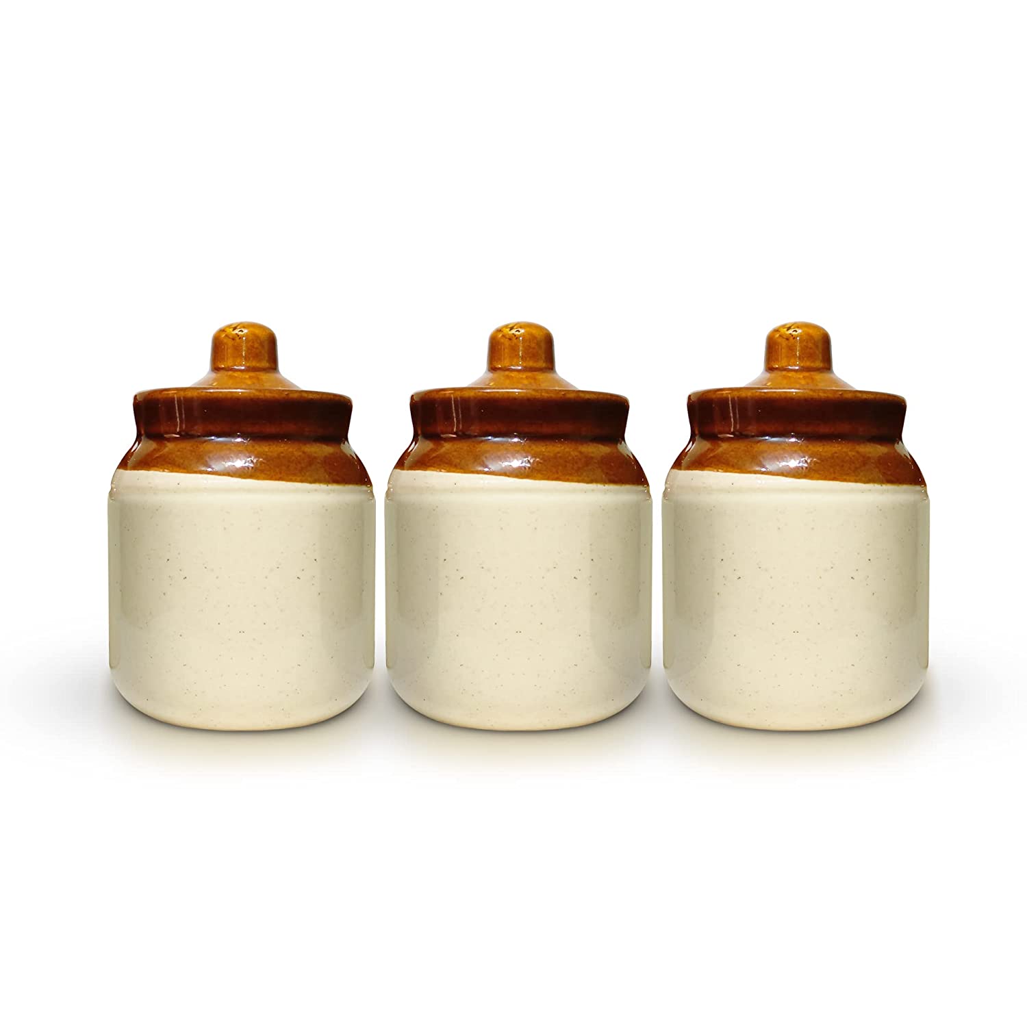 Yellow ceramic jar with lid on kitchen countertop beside spices and olive oil bottle.