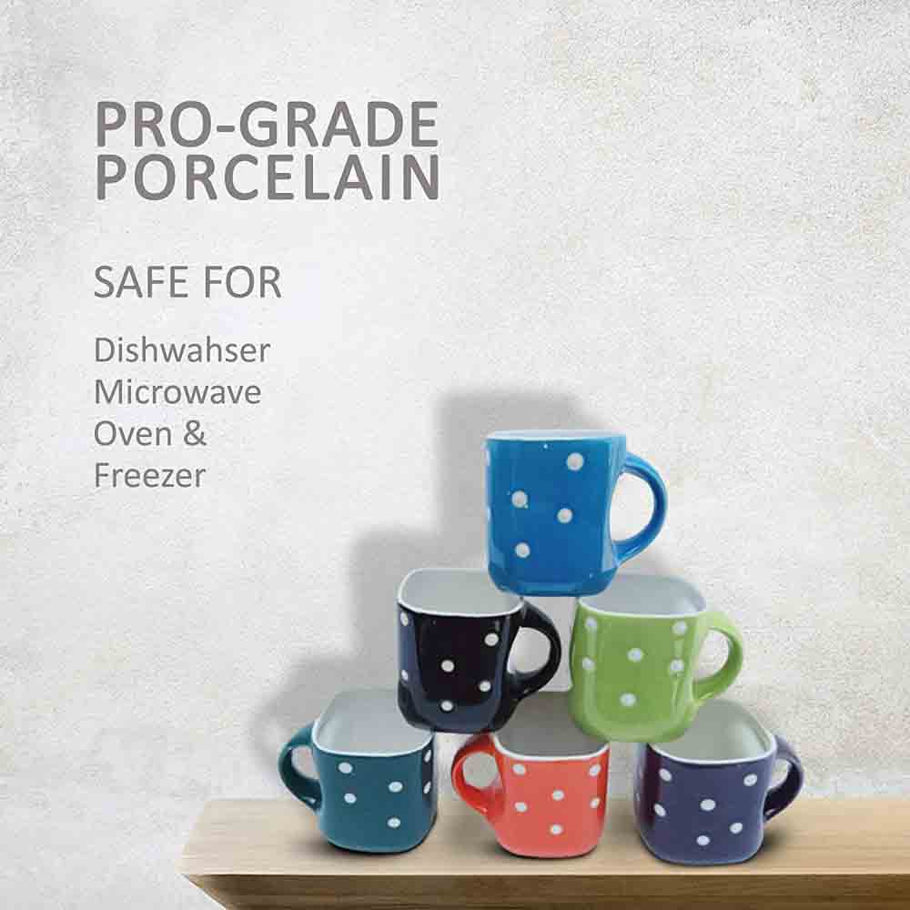 nullMulticolor ceramic tea cup with white dots displayed from the top angle to showcase the contrast between vibrant exterior and pristine white interior