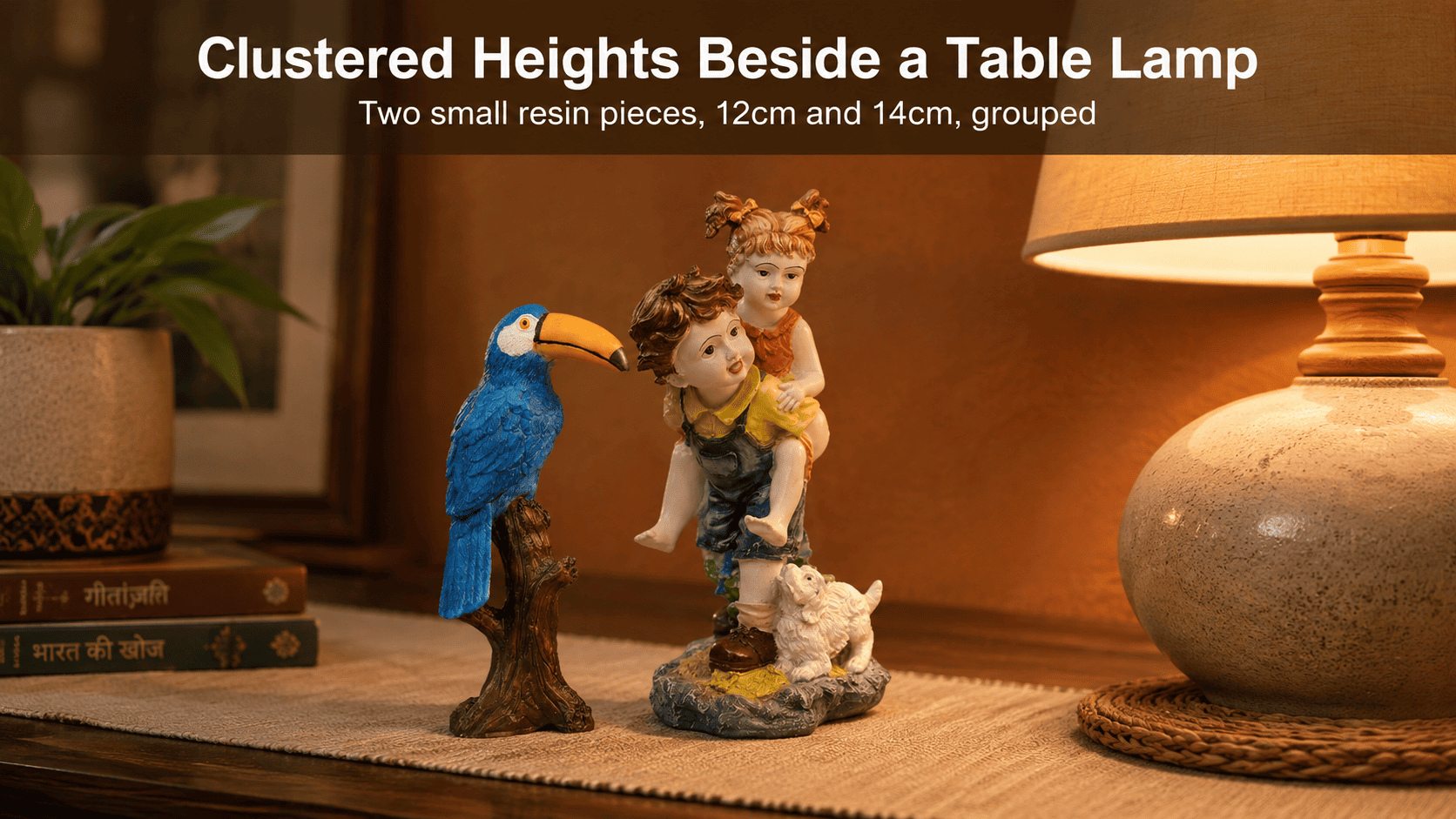 cluster of small decor pieces in warm earth tones on a console near a lamp