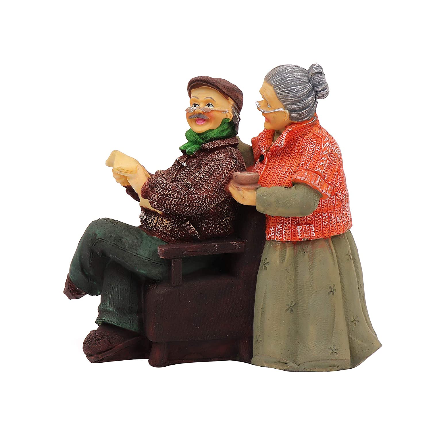 Dada Dadi statue in the kitchen, with Dadi offering tea to Dada reading newspaper.