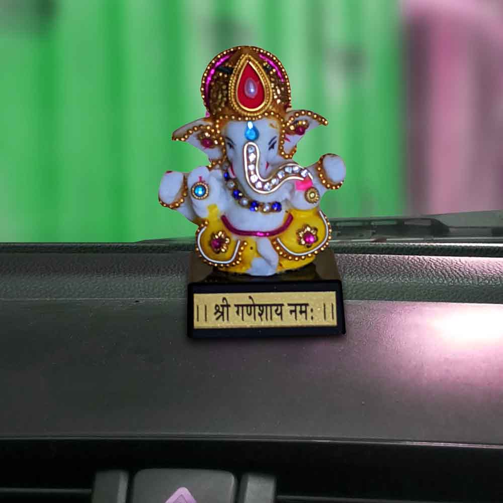 top-online-decoration-for-ganesh-chaturthi-with-a-white-ganesh-idol-with-mukut.jpg