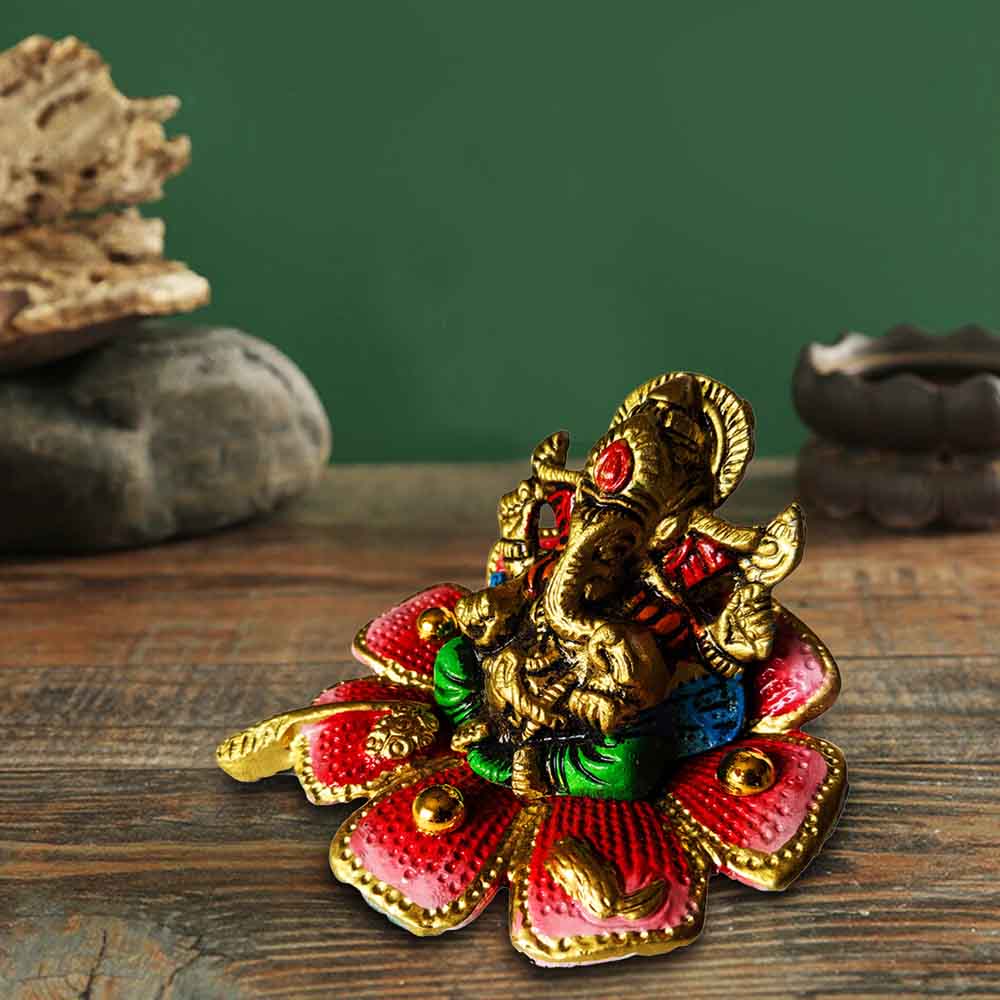 Small Golden Ganesh Idol  on a flower for Ganesh Chaturthi Decoration