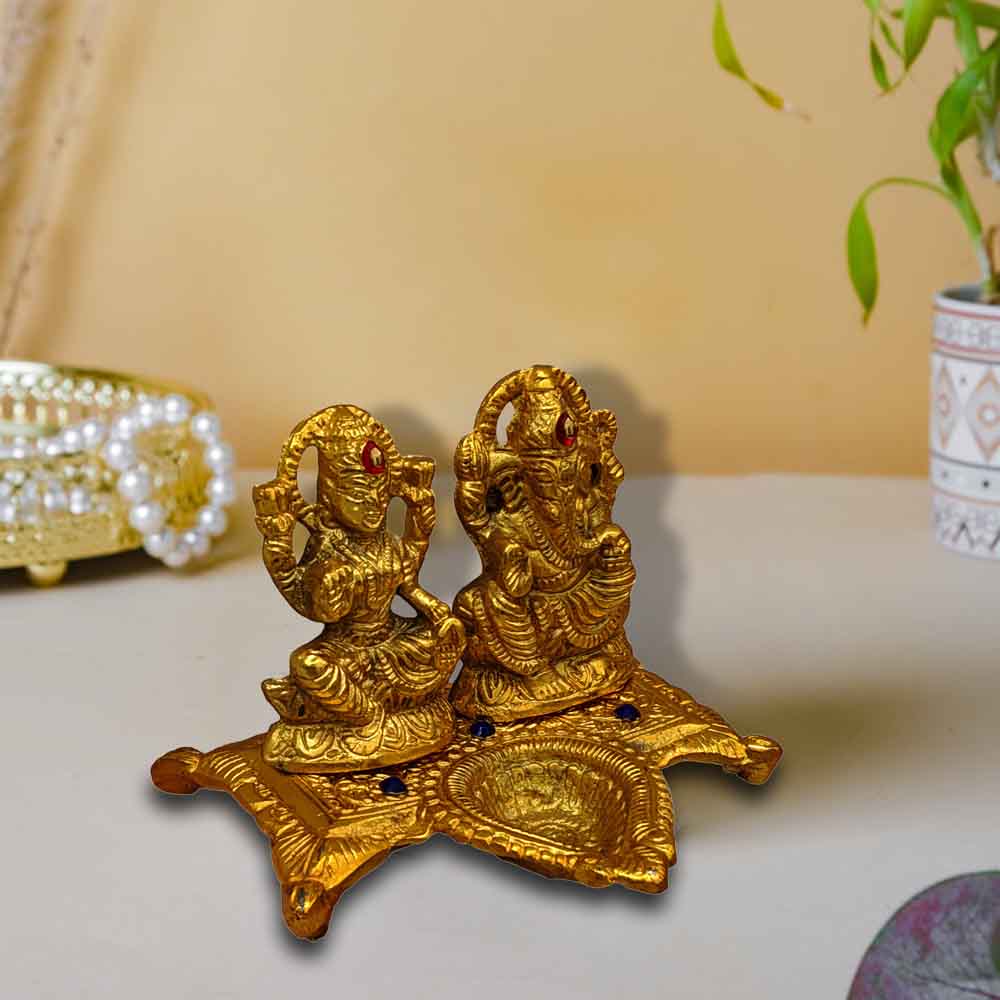top-small-metal-ganesh-lakshmi-idol-on-chowki-for-ganesh-chaturthi-online.jpg
