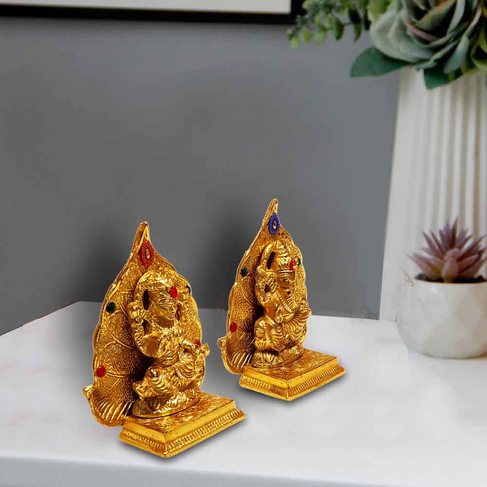 top-metal-ganesh-and-lakshmi-motifs-on-leaf-for-ganesh-chaturthi-online.jpg