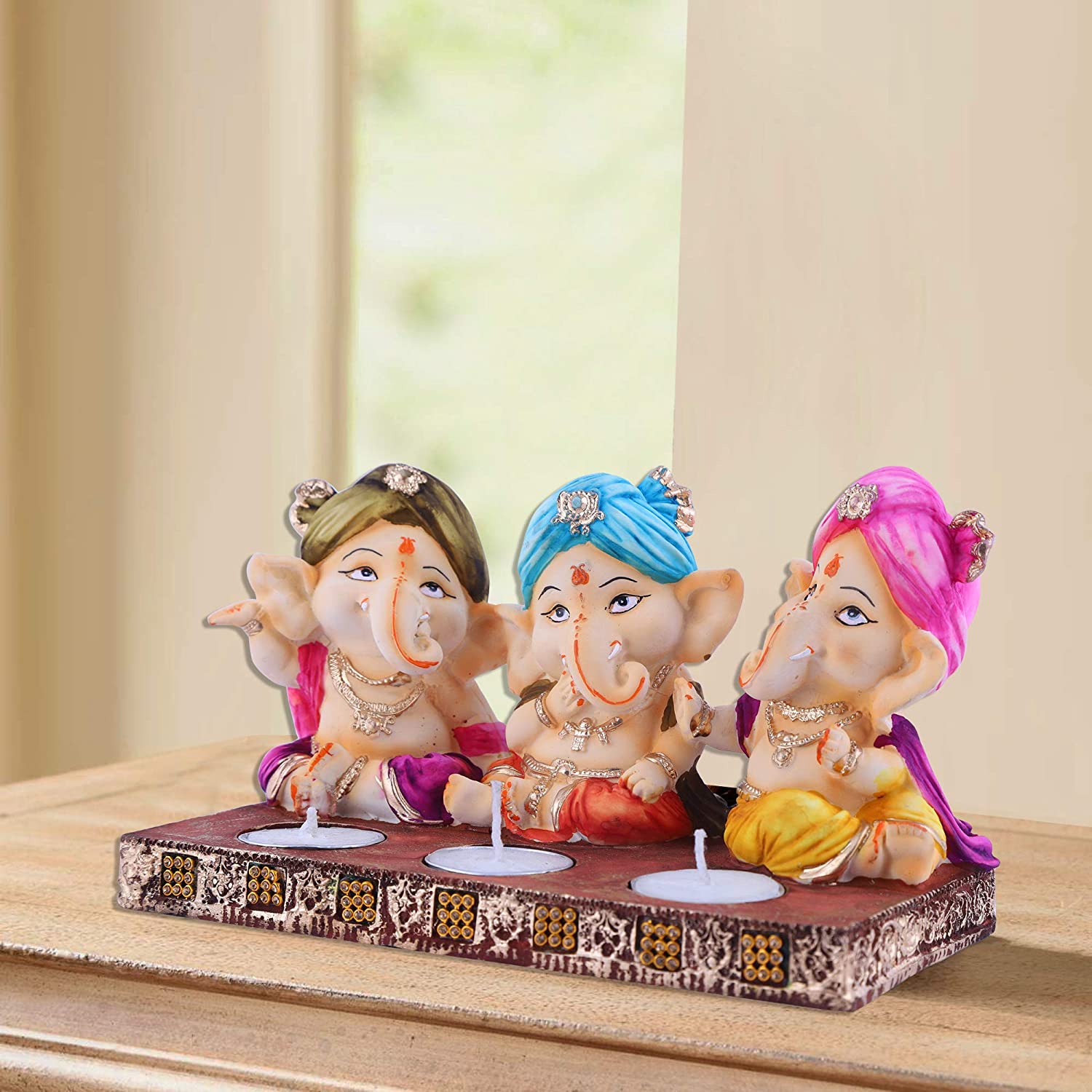 best-three-baby-ganesh-idol-with-tea-lights-for-vinayagar-chaturthi-decoration-shopping.jpg