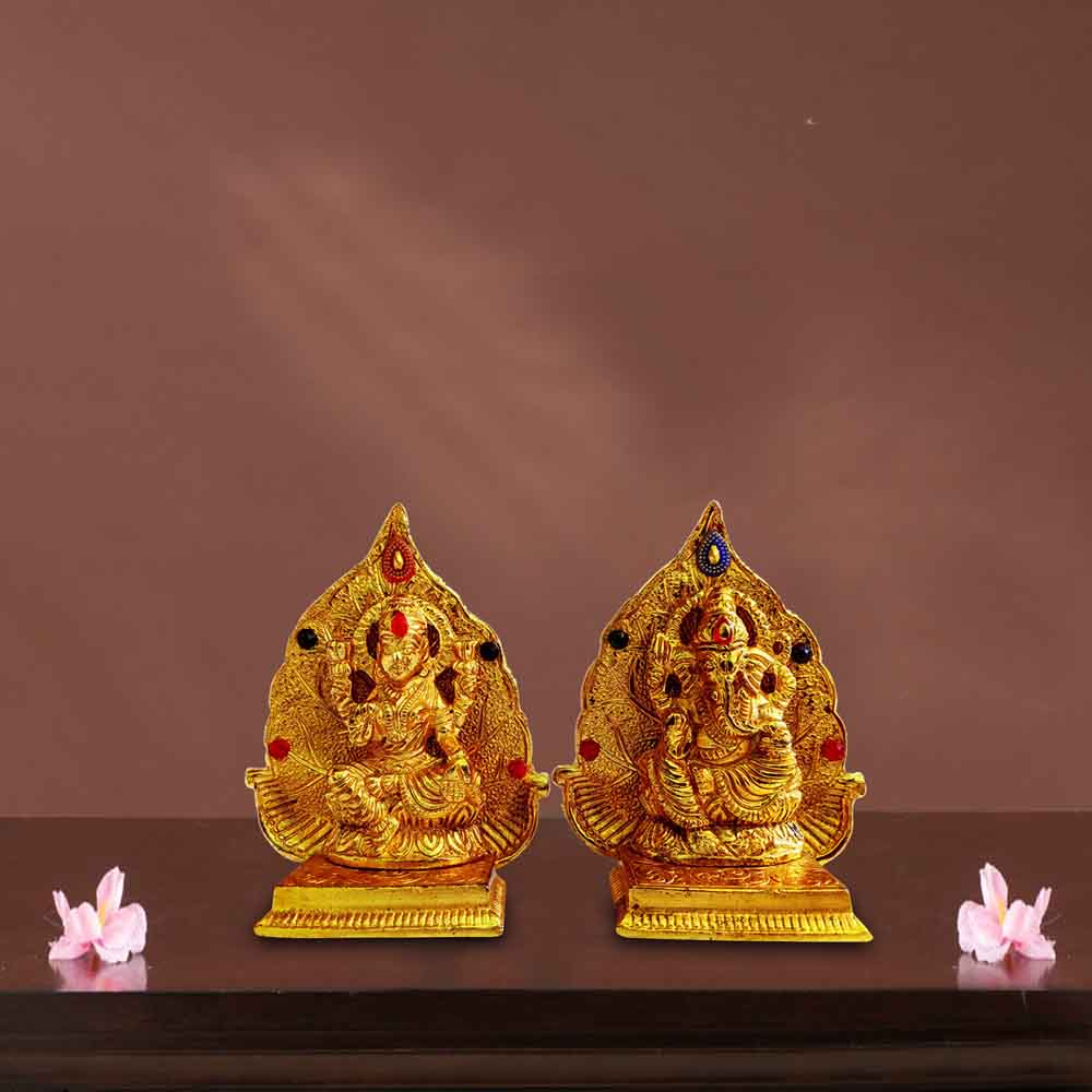 best-online-pooja-for-ganesha-sankashti-with-metal-ganesh-and-lakshmi-motifs-on-leaf.jpg