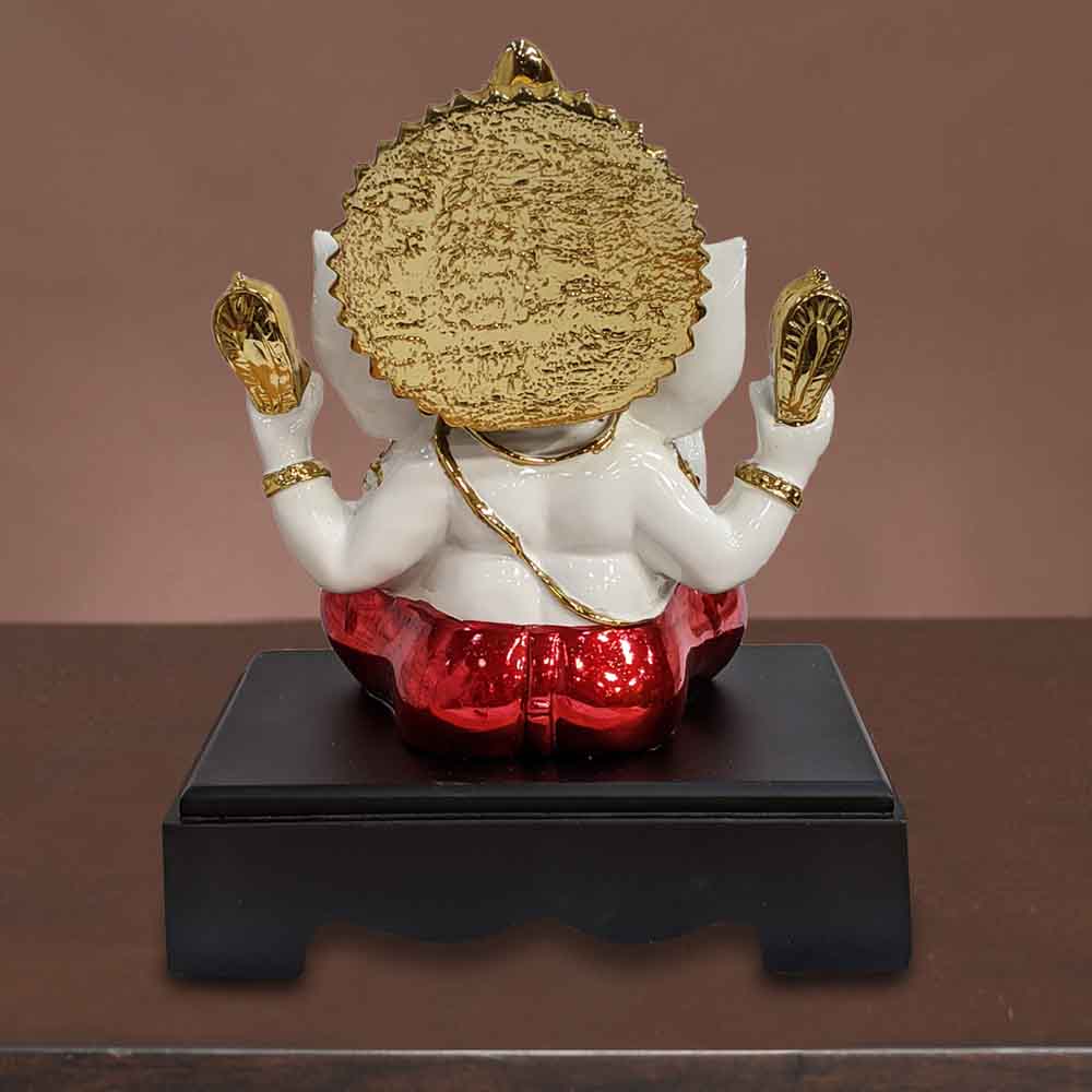 top-sitting-golden-ganesh-idol-wearing-red-dhoti-for-ganesha-sankashti-in-india.jpg