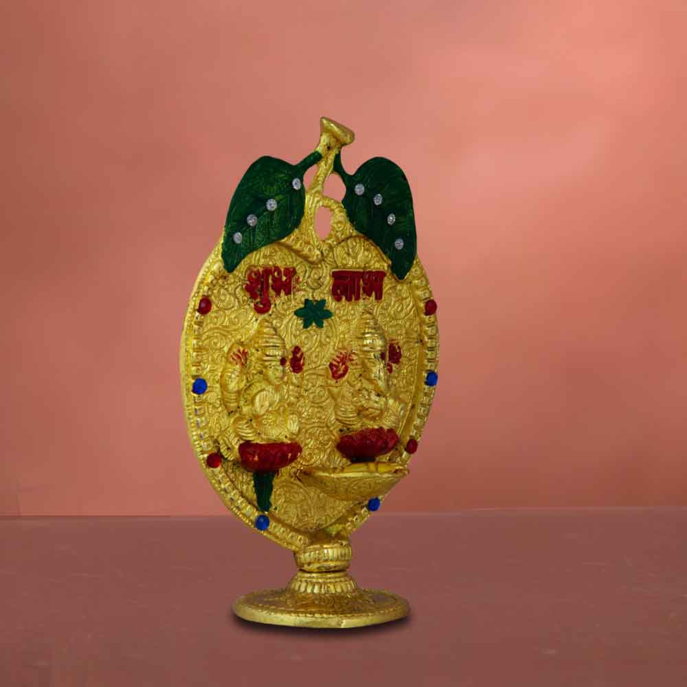 top-metal-ganesh-lakshmi-motif-on-leaf-for-diwali-in-india.jpg