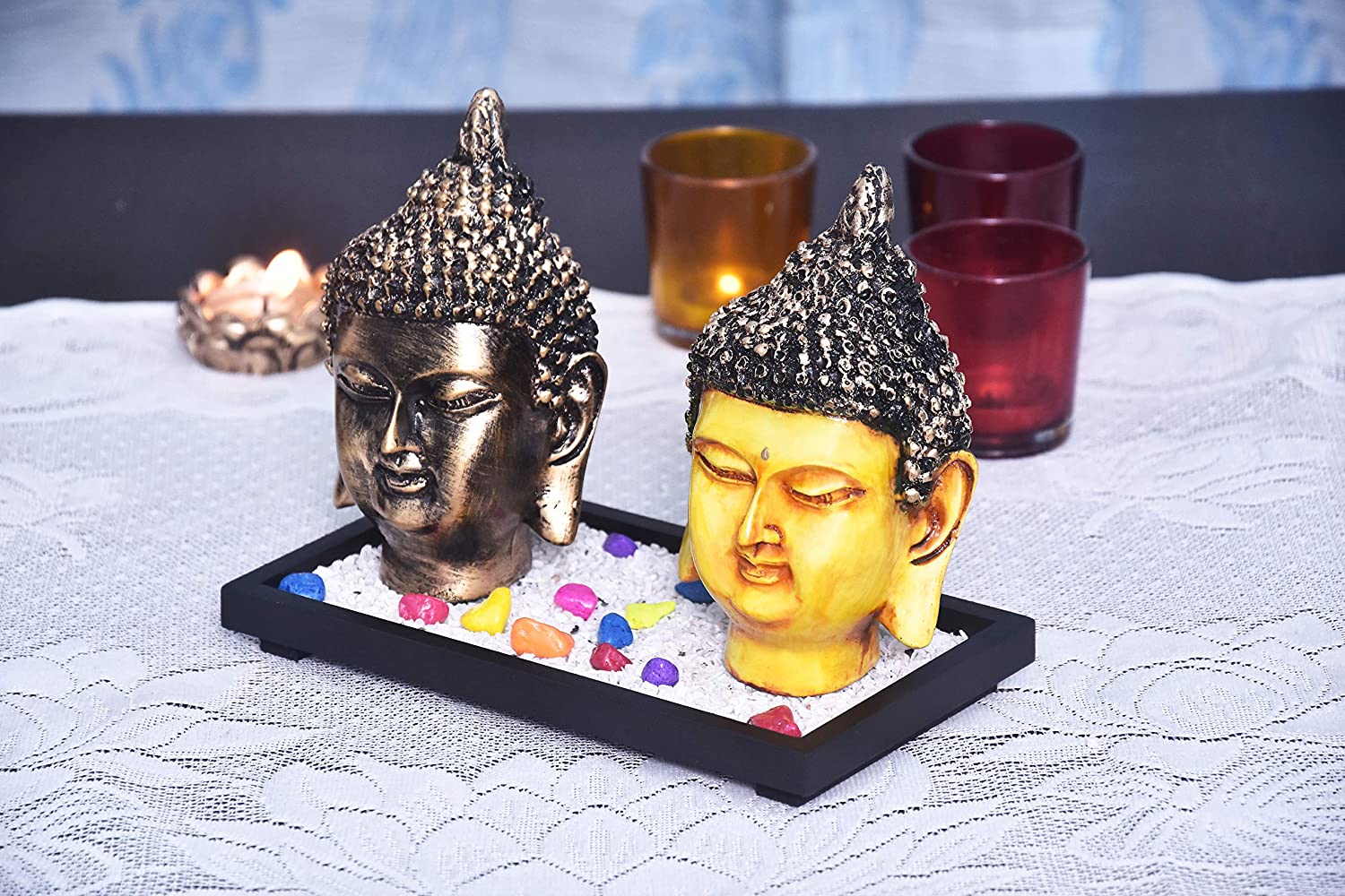 325688-top-set-of-two-antique-buddha-face-showpieces-on-wooden-tray-with-pebbles-online.jpg