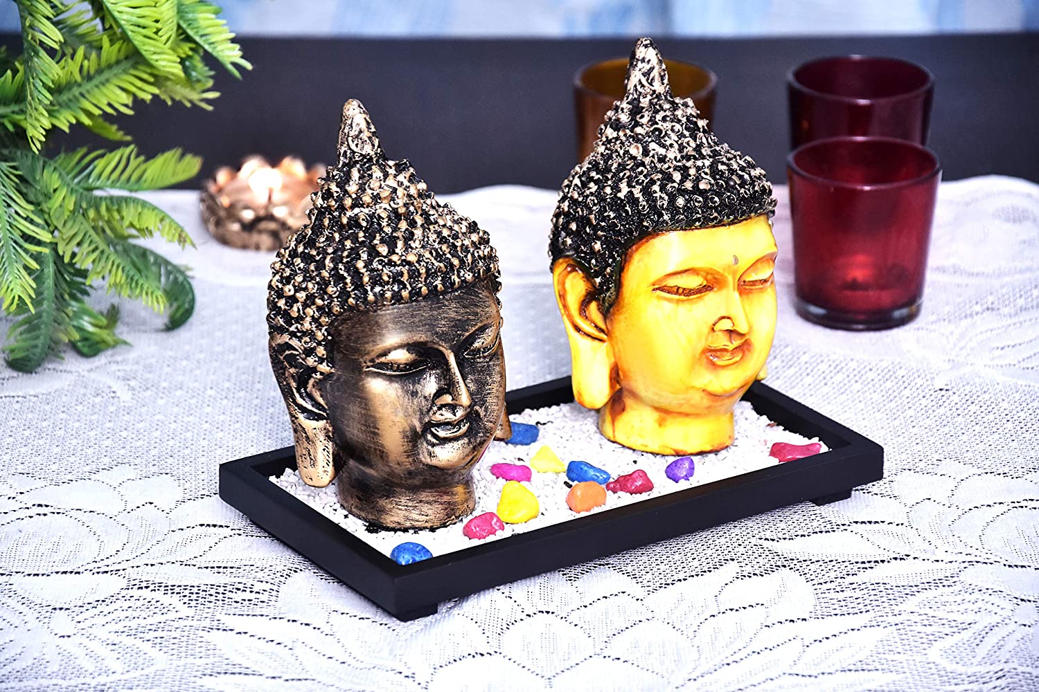325688-top-set-of-two-antique-buddha-face-showpieces-on-wooden-tray-with-pebbles-india.jpg