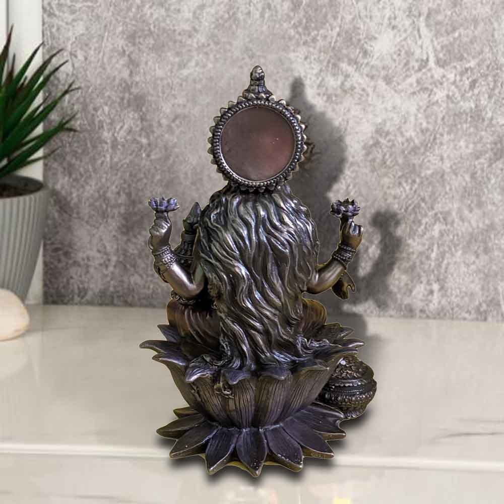 325711-top-antique-cold-cast-lakshmi-showpiece-sitting-on-lotus-flower-holding-kalash-india.jpg