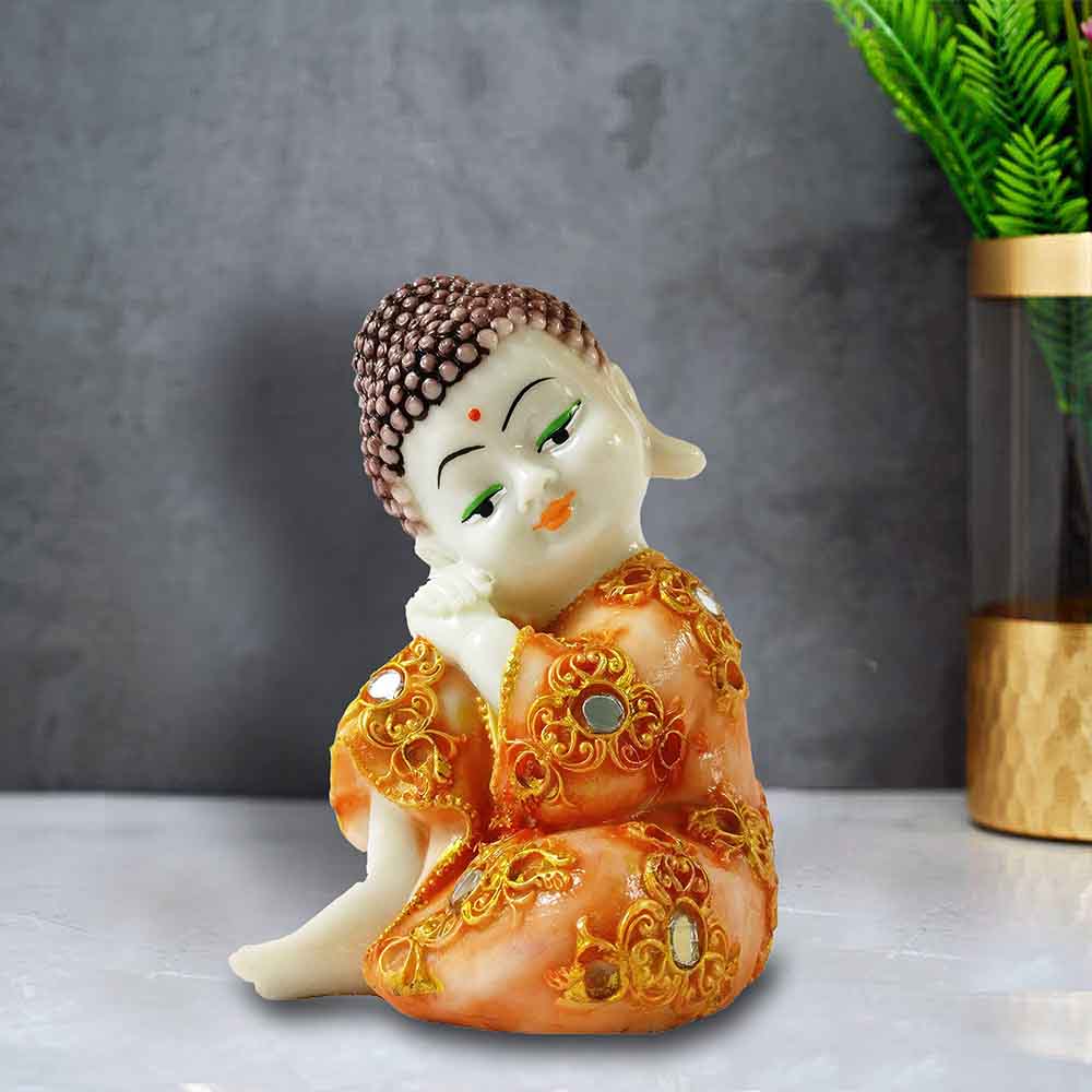 White Baby Buddha Wearing Orange Robe in Thinking Pose Unique Showpiece for Dining Room
