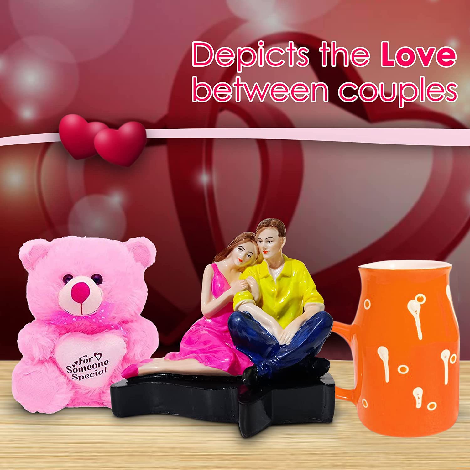 326256-top-couple-statue-with-orange-milk-mug-and-pink-teddy-holding-a-heart-for-anniversary-gifts-in-india.jpg