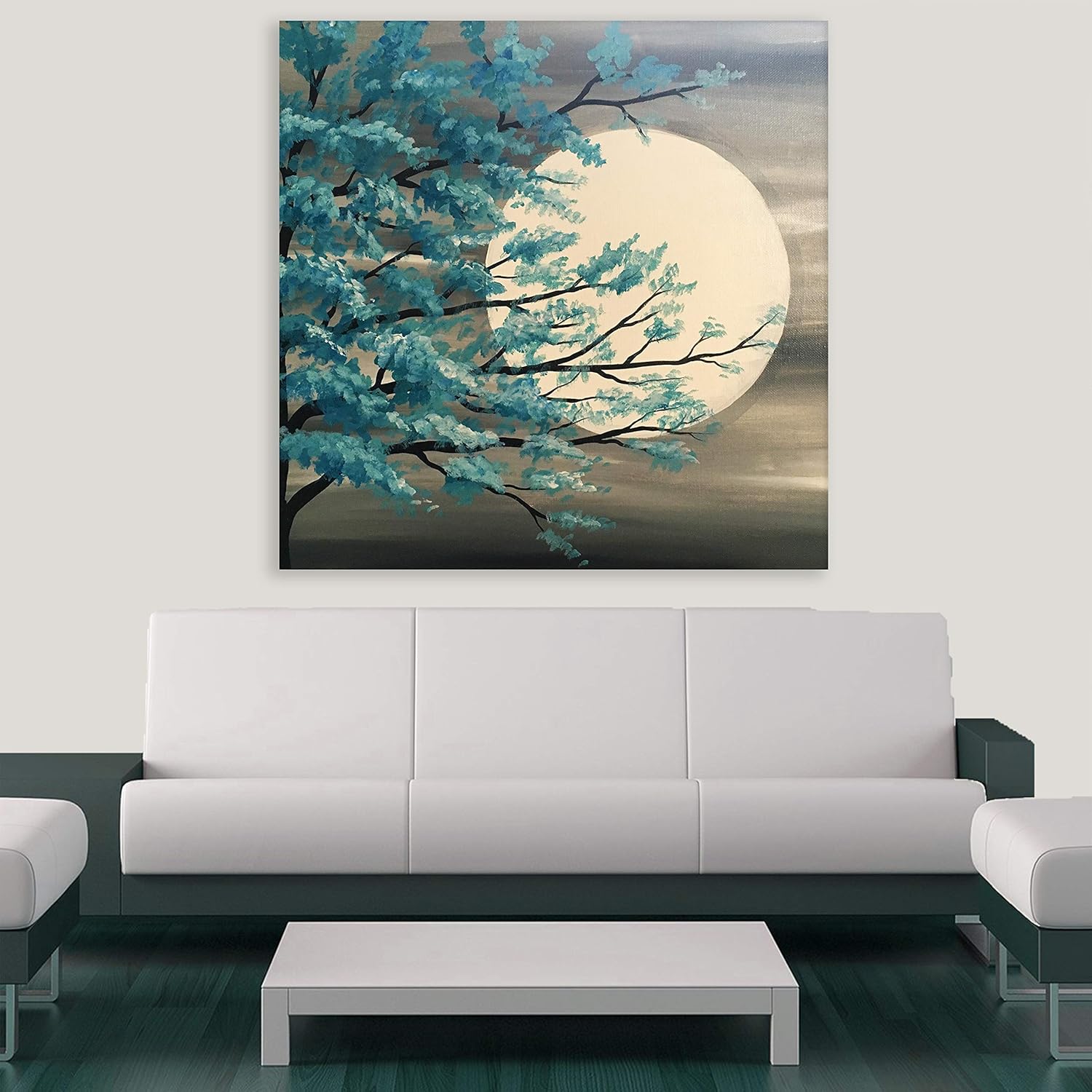 Moonstruck Aqua Canvas: Abstract Unframed Wall Art depicting a glowing aqua moon on a cozy living room wall