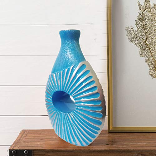 Blue Handmade Vase with sun motif, displayed on kitchen countertop next to fresh flowers.