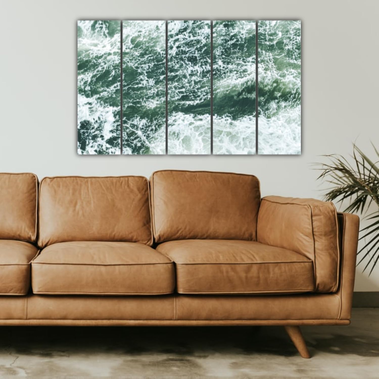 Multi-frame Water Waves Wall Art with laminated finish and hooks ready to hang in living room.