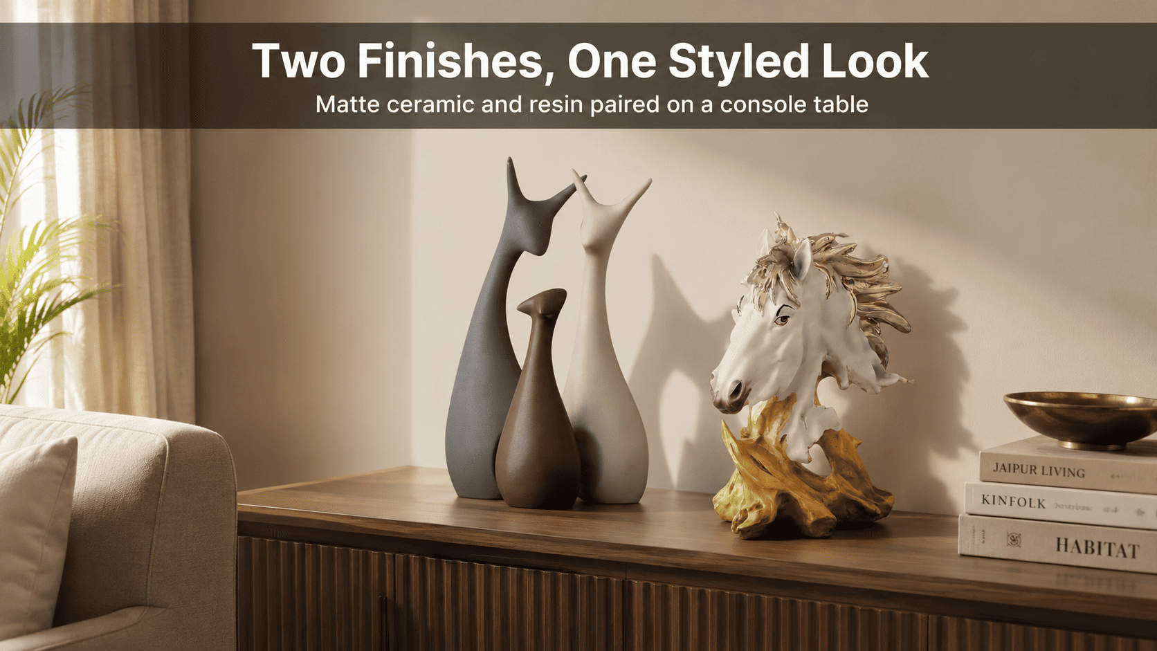 grouped home decor pieces on a console table
