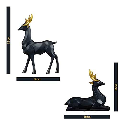 Standing and sitting deer family statues displayed on a kitchen countertop, highlighting the black and golden geometric design.