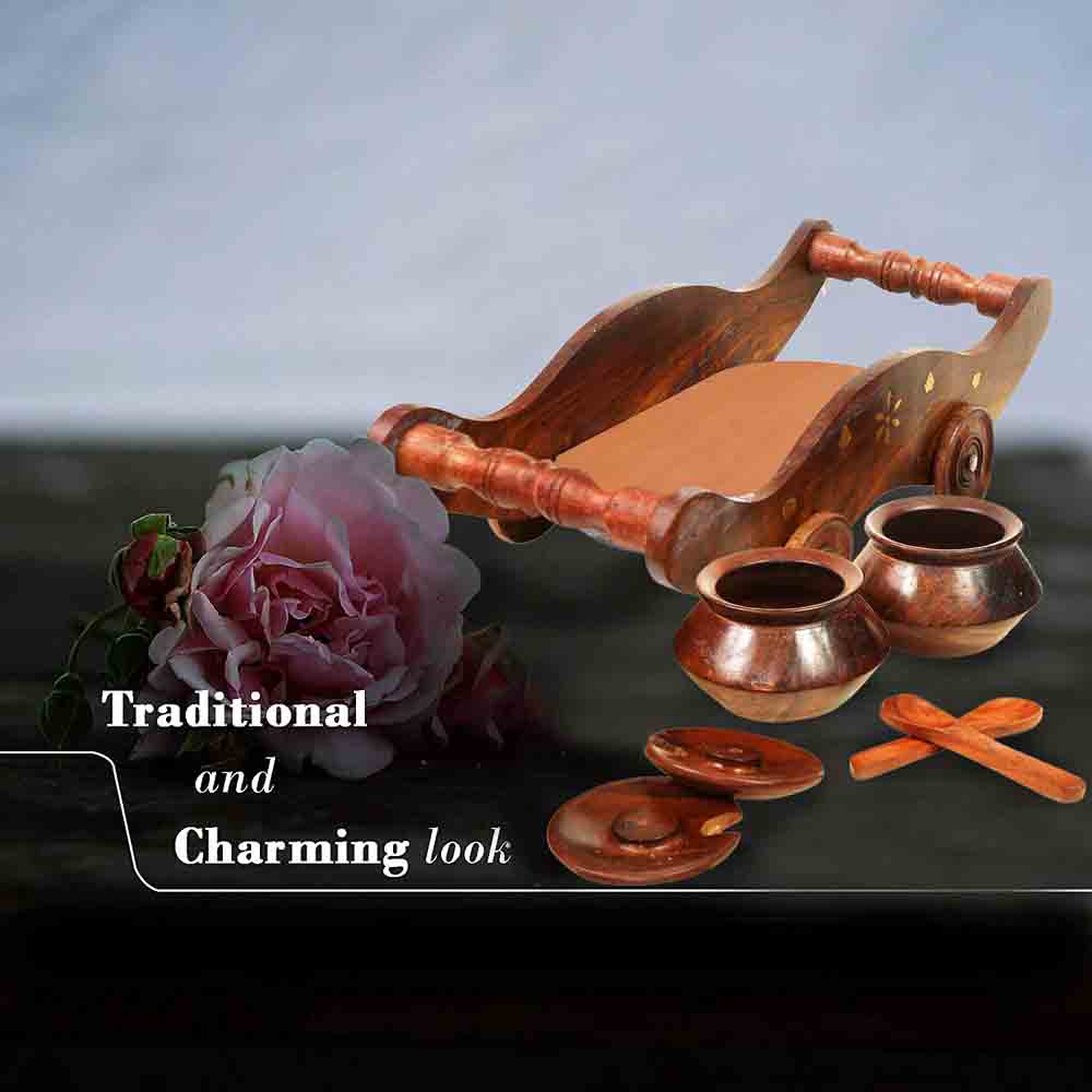 Elegant Sheesham wood dry fruit storage trolley with golden embellishments on a kitchen countertop.
