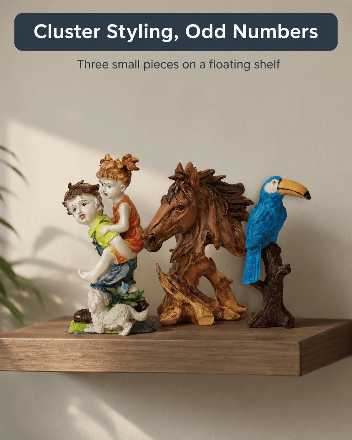 cluster of small modern home decor pieces on a floating shelf