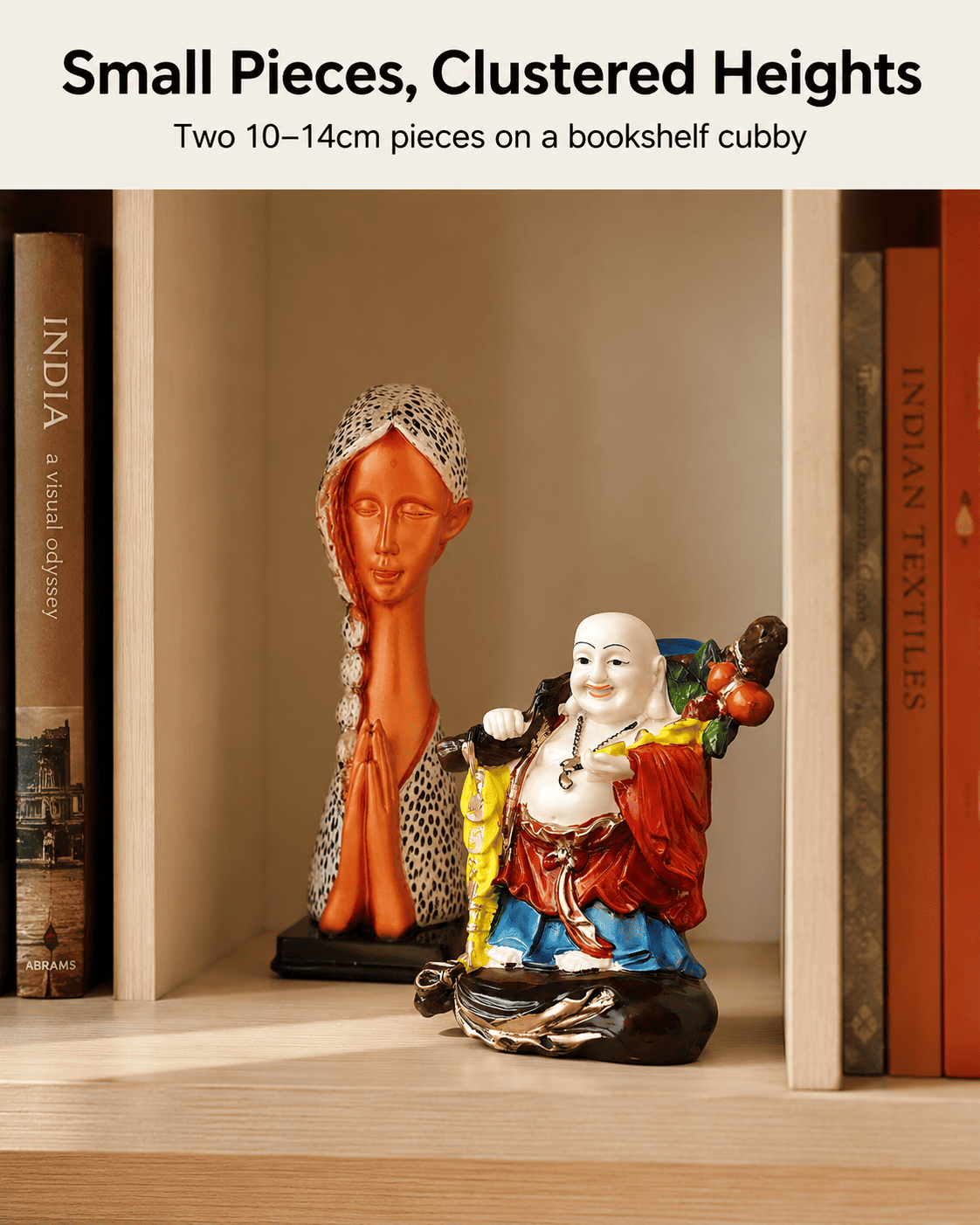 Small decorative pieces grouped together on a bookshelf