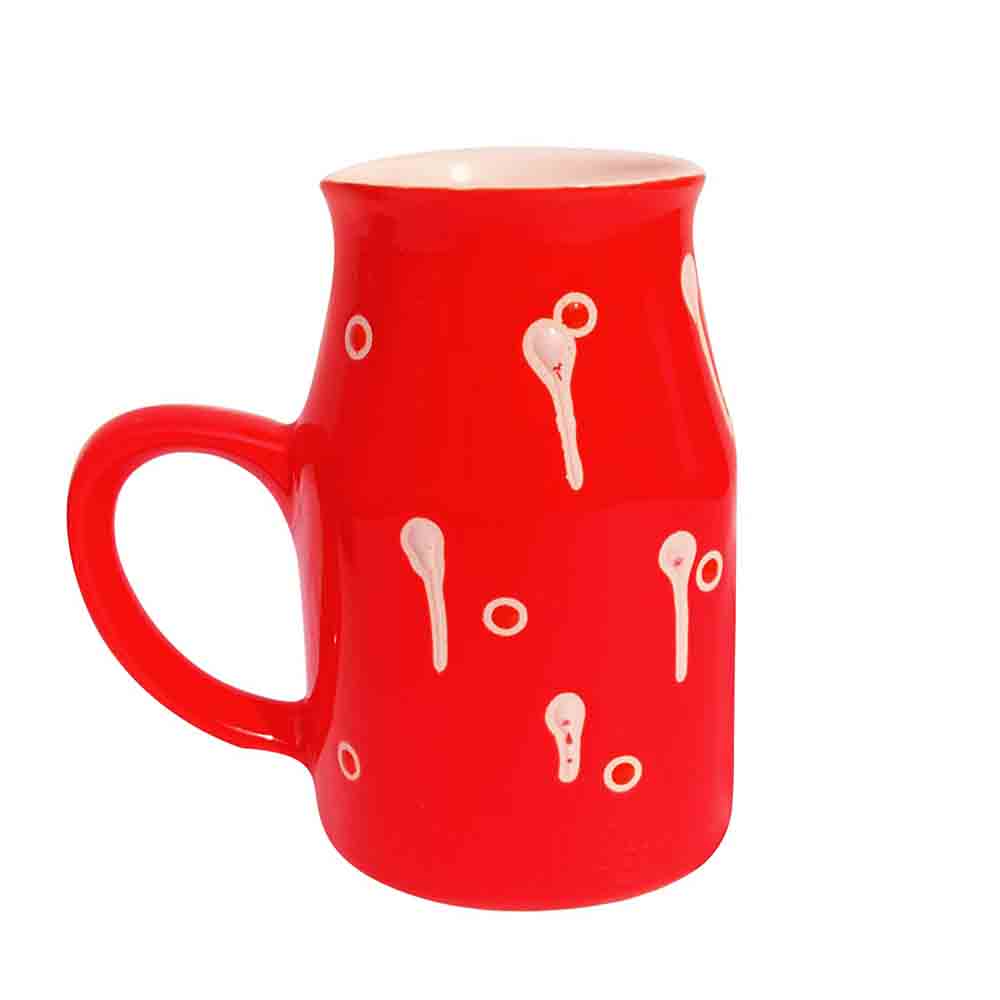 Red Coffee Mug 500ml with handpainted white drop pattern on kitchen counter.