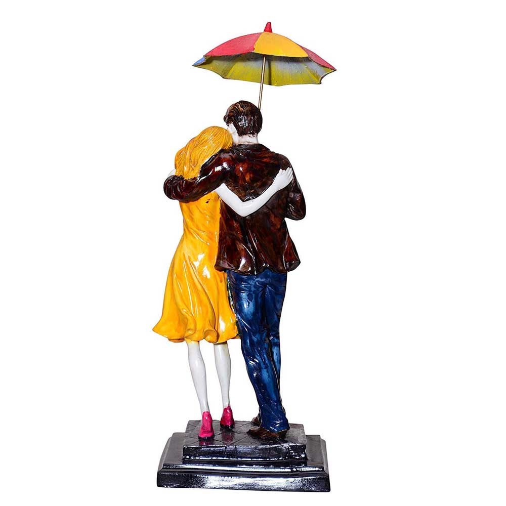 Statue of Love Couple holding an Umbrella