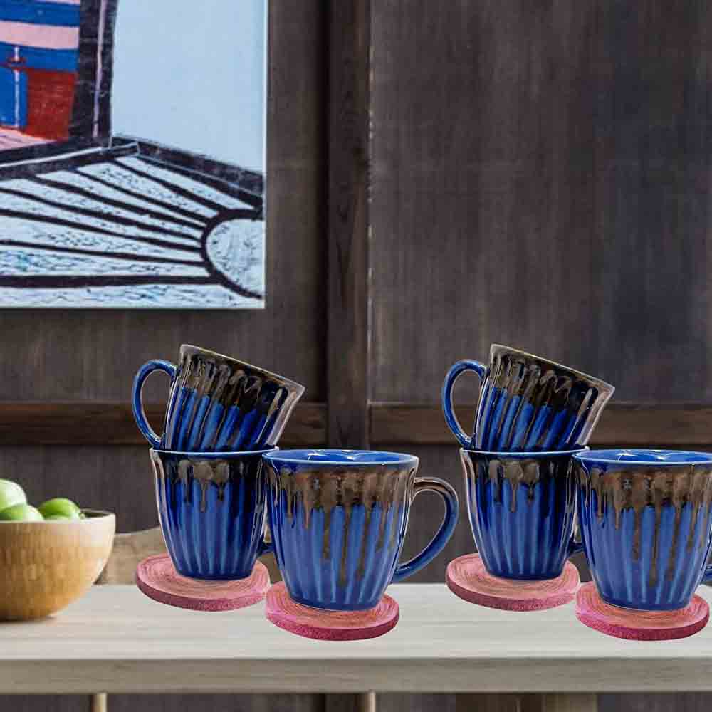 Blue Tea Cups Set for Kitchen Image - Elegant blue ceramic tea cups with decorative patterns displayed on a wooden kitchen shelf, set of 6.