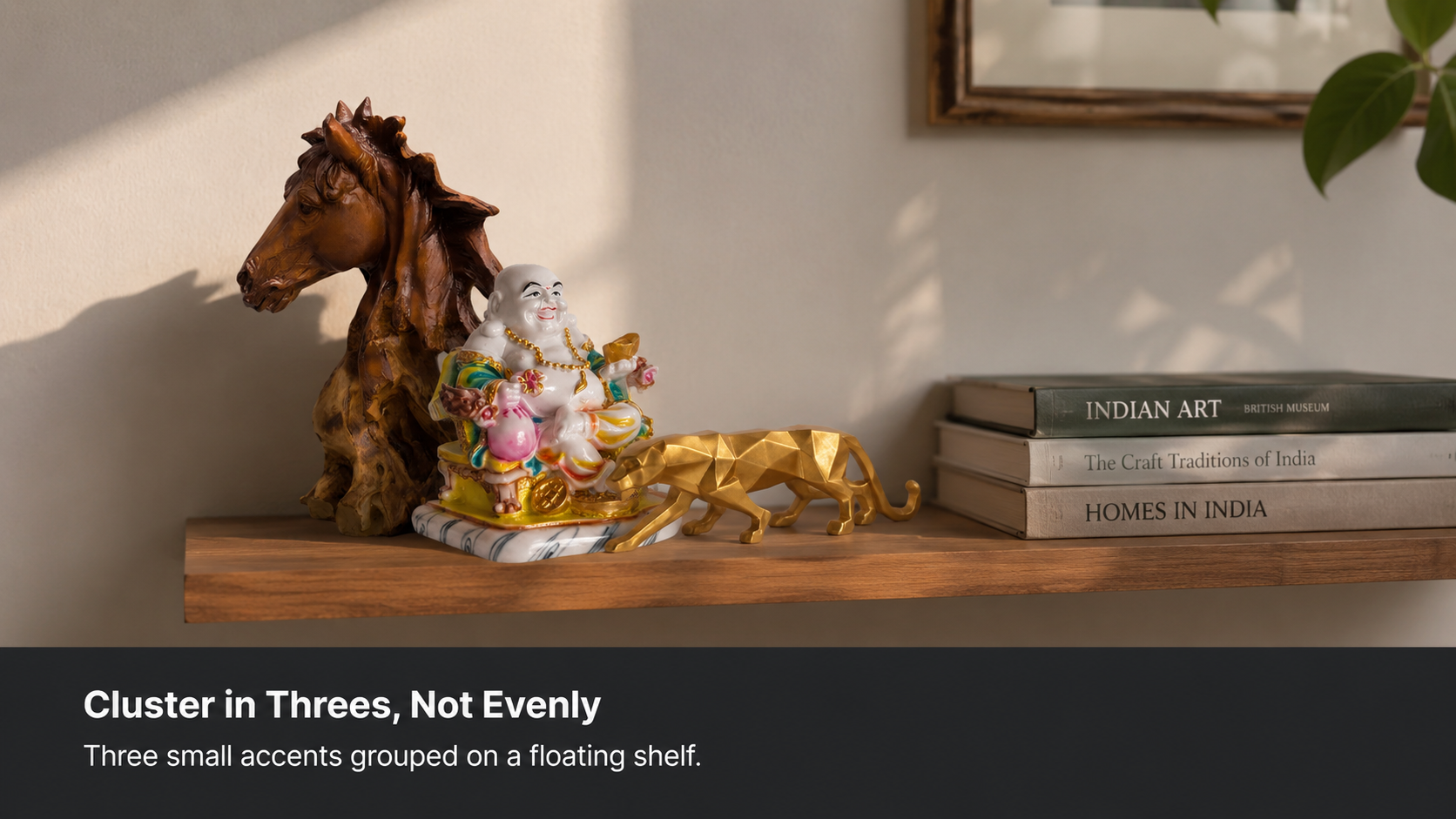 three small decorative pieces grouped on a floating shelf