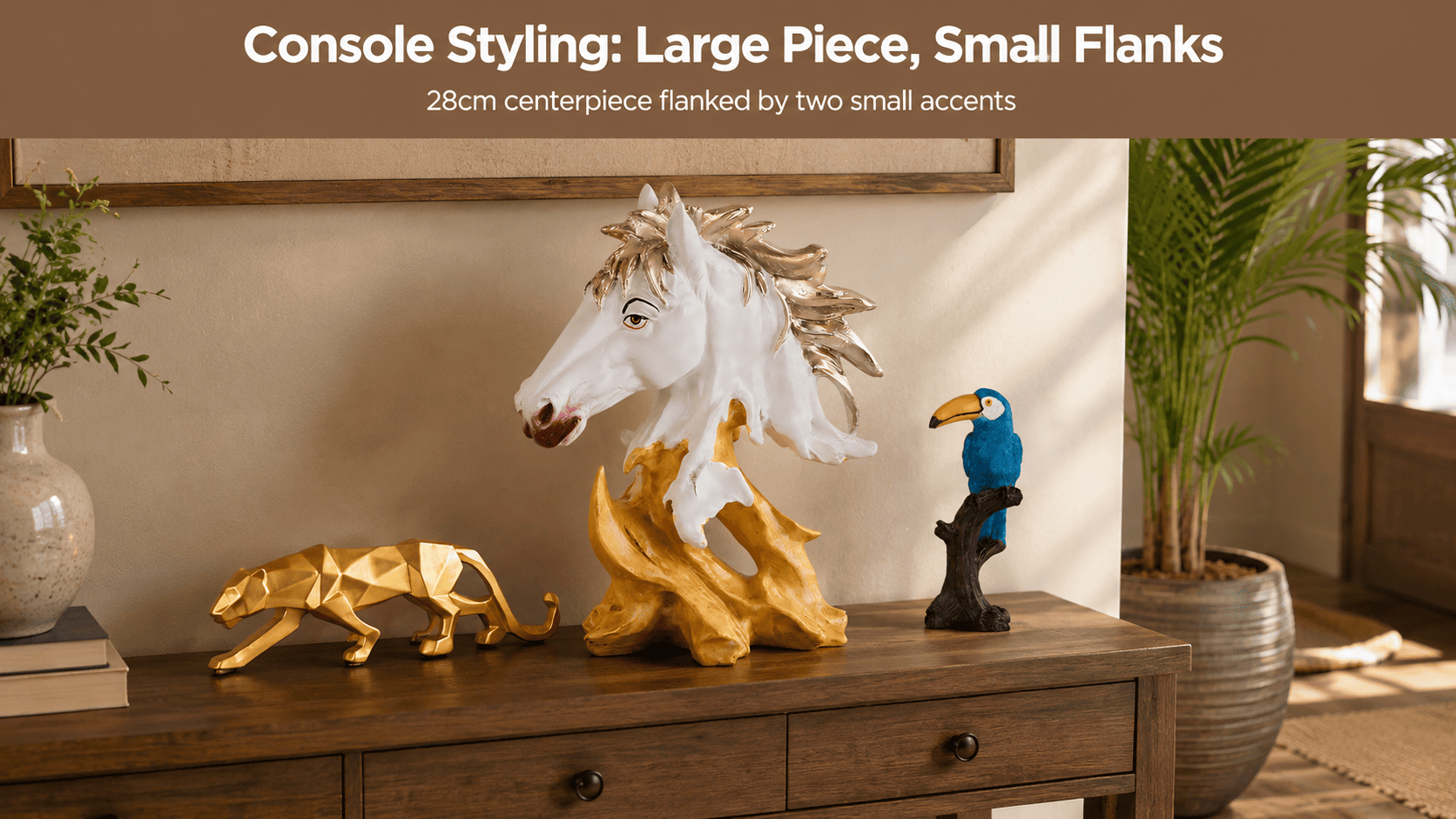 console table styled with a large centerpiece and two smaller accent pieces