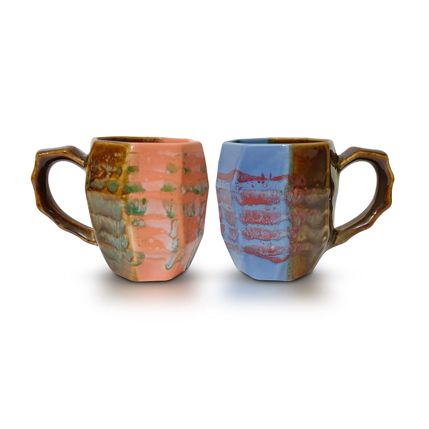 Orange and blue artisanal coffee mug with unique brush strokes, displayed on a kitchen counter.