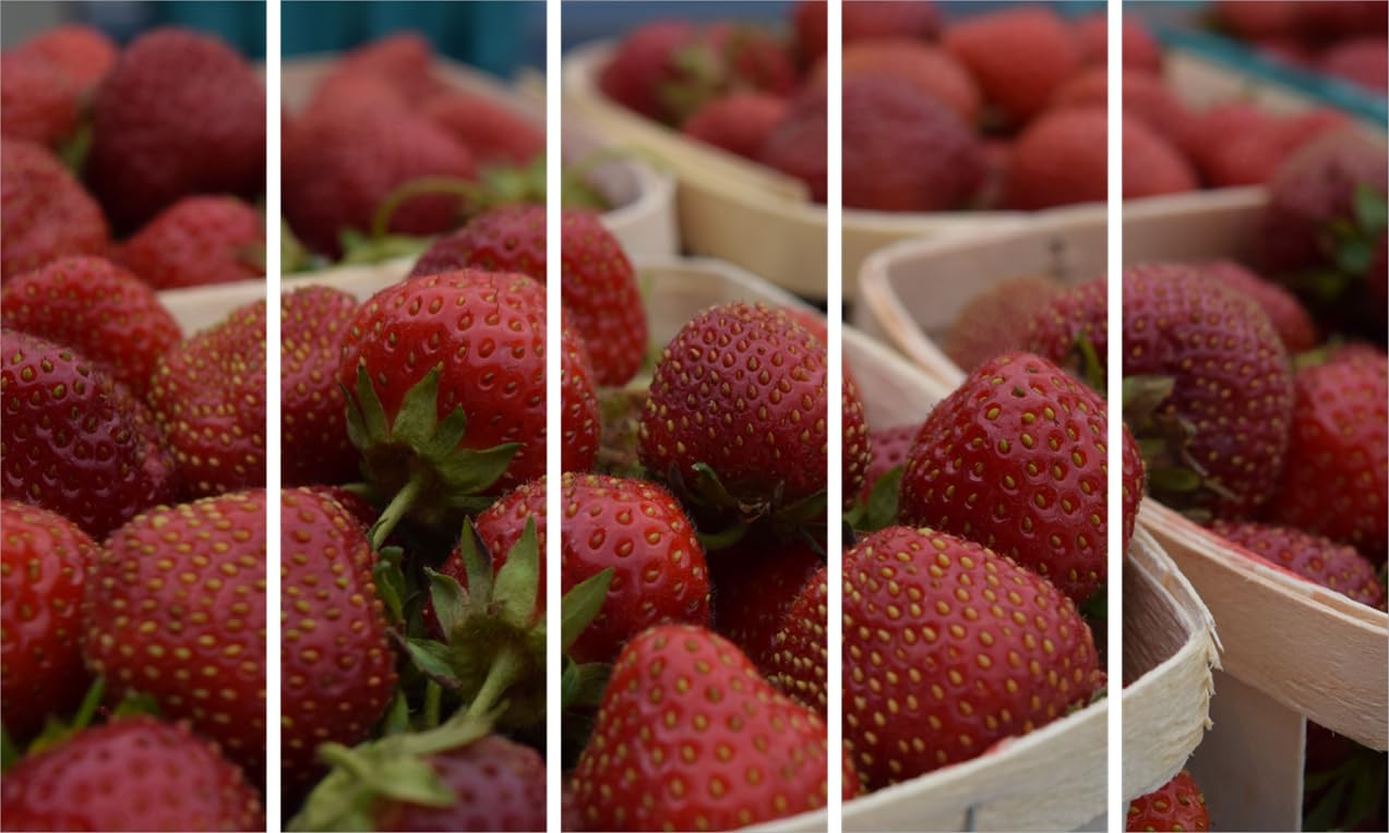 Close-up of vibrant red strawberries in the 5-panel Berry Good Vibrations: Framed Strawberry Photography Wall Art mounted on a living room wall