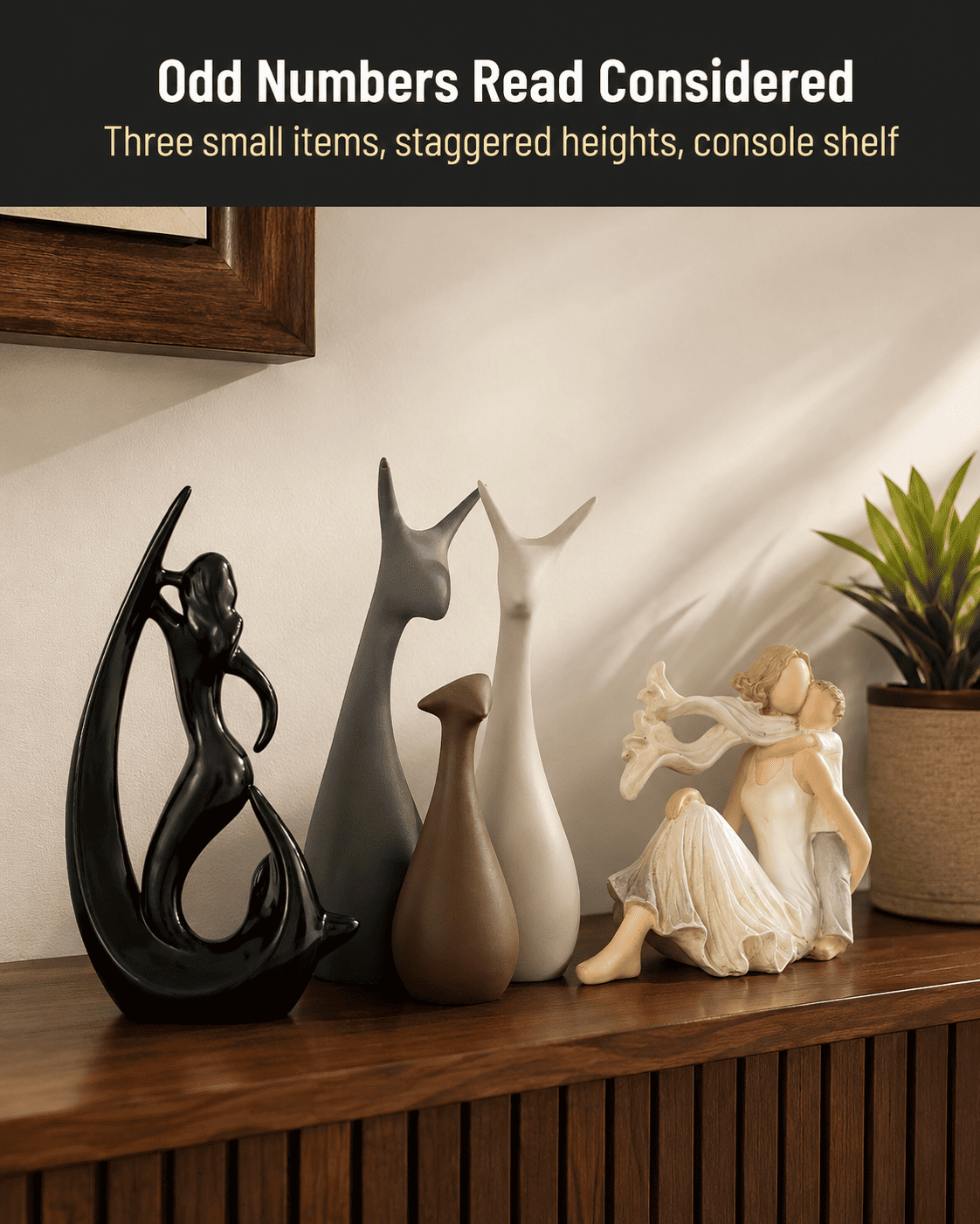 cluster of small decorative items grouped on a console shelf