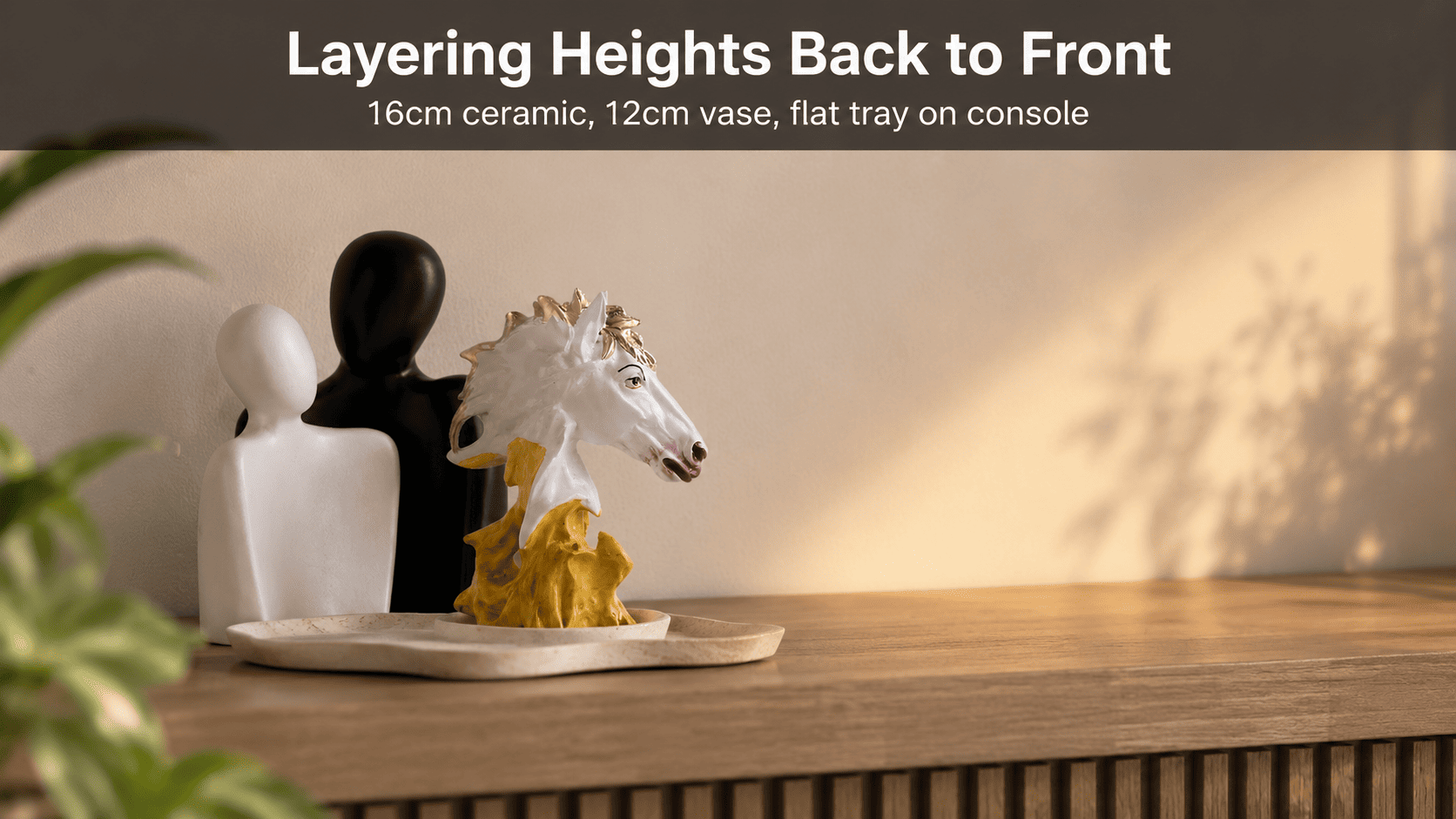 matte and glazed decor accents grouped on a console shelf