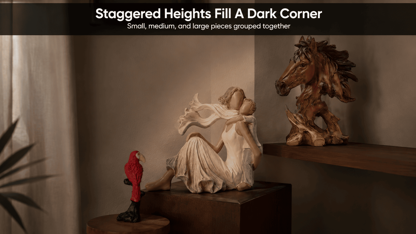 grouped decor pieces of varying heights in a dark room corner