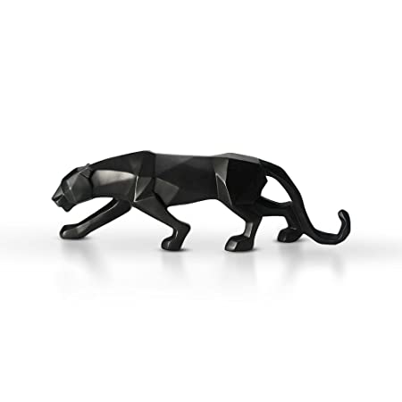 Black Panther Statue on a kitchen countertop next to potted herbs and spices.