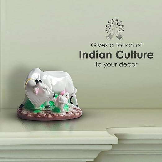 Close-up of the textured details on a White Cow and Calf Statue, emphasizing the tender expression of the mother cow as she looks down at her calf.